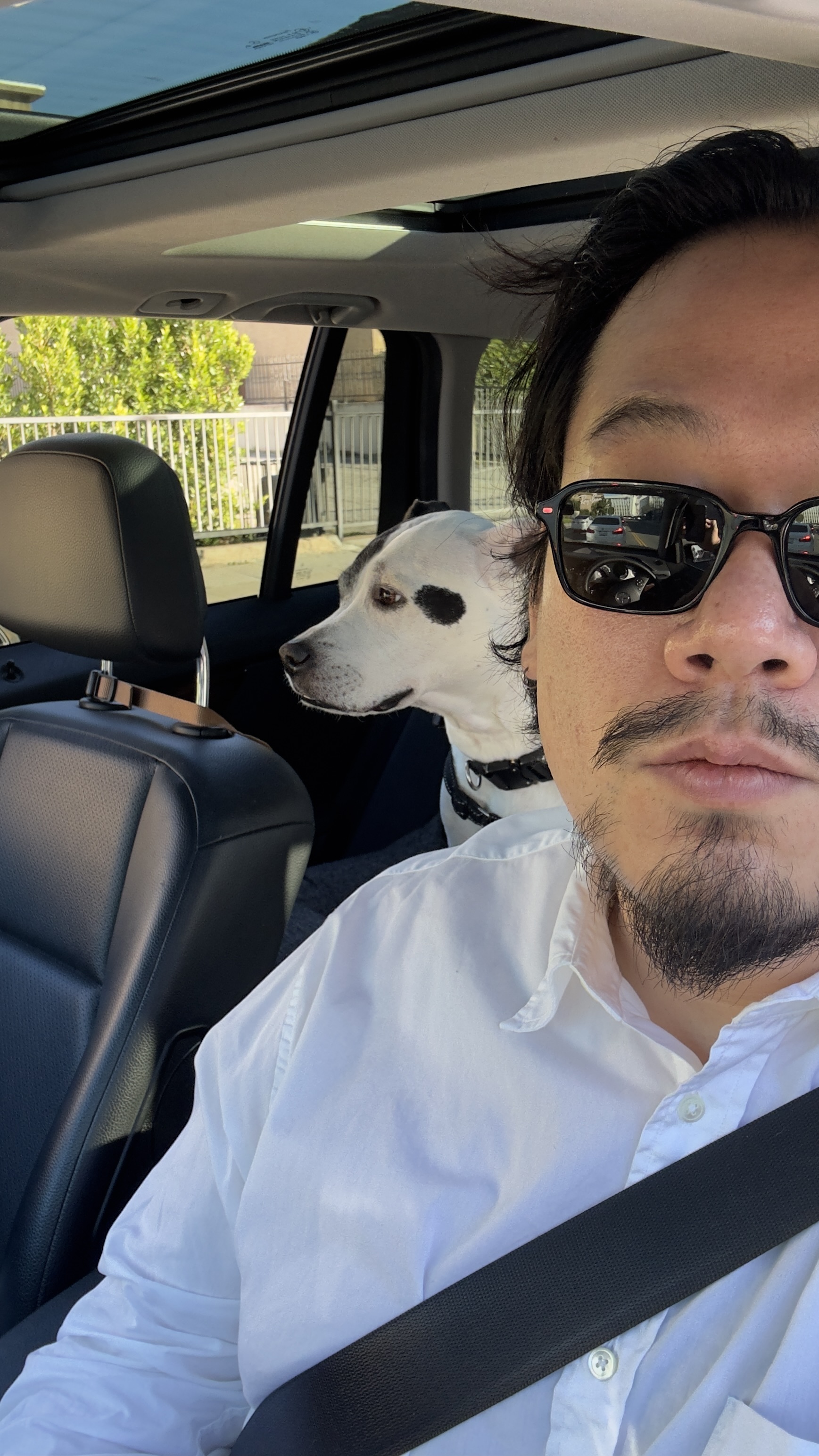 Portrait of Nate Chu with his dog Snoopy
